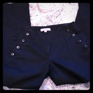 Loft black mid rise pants with button detail.